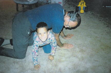 Emmet* Aldon West playing with his daughter's son, Kolby Lynn Ke