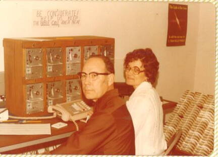 Emmet* Aldon (EA) West and wife Novie work BibleCal at Brown Tra
