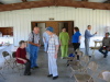 Leta West Jackson in blue hat. Novie Thompson West in green. Nesa Love in blue shirt. Emmet West pointing.
